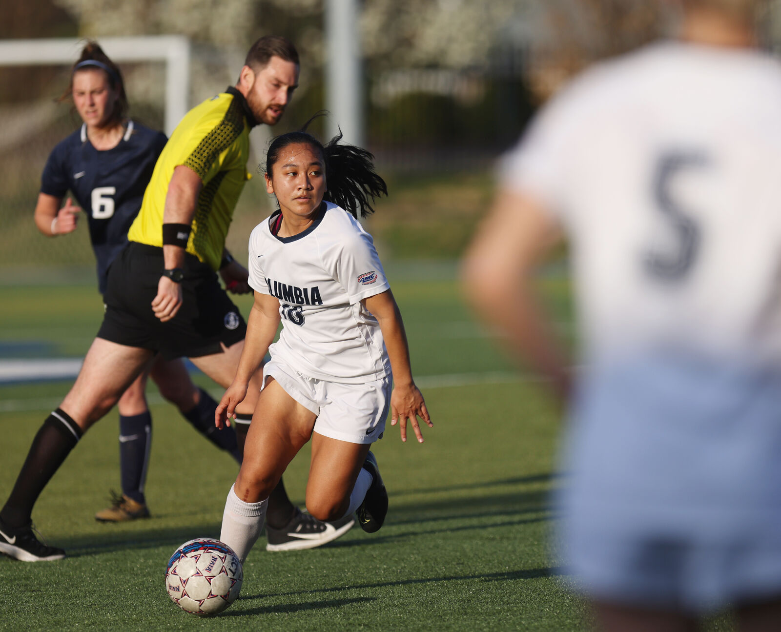 Natalie Peng looks to pass the ball